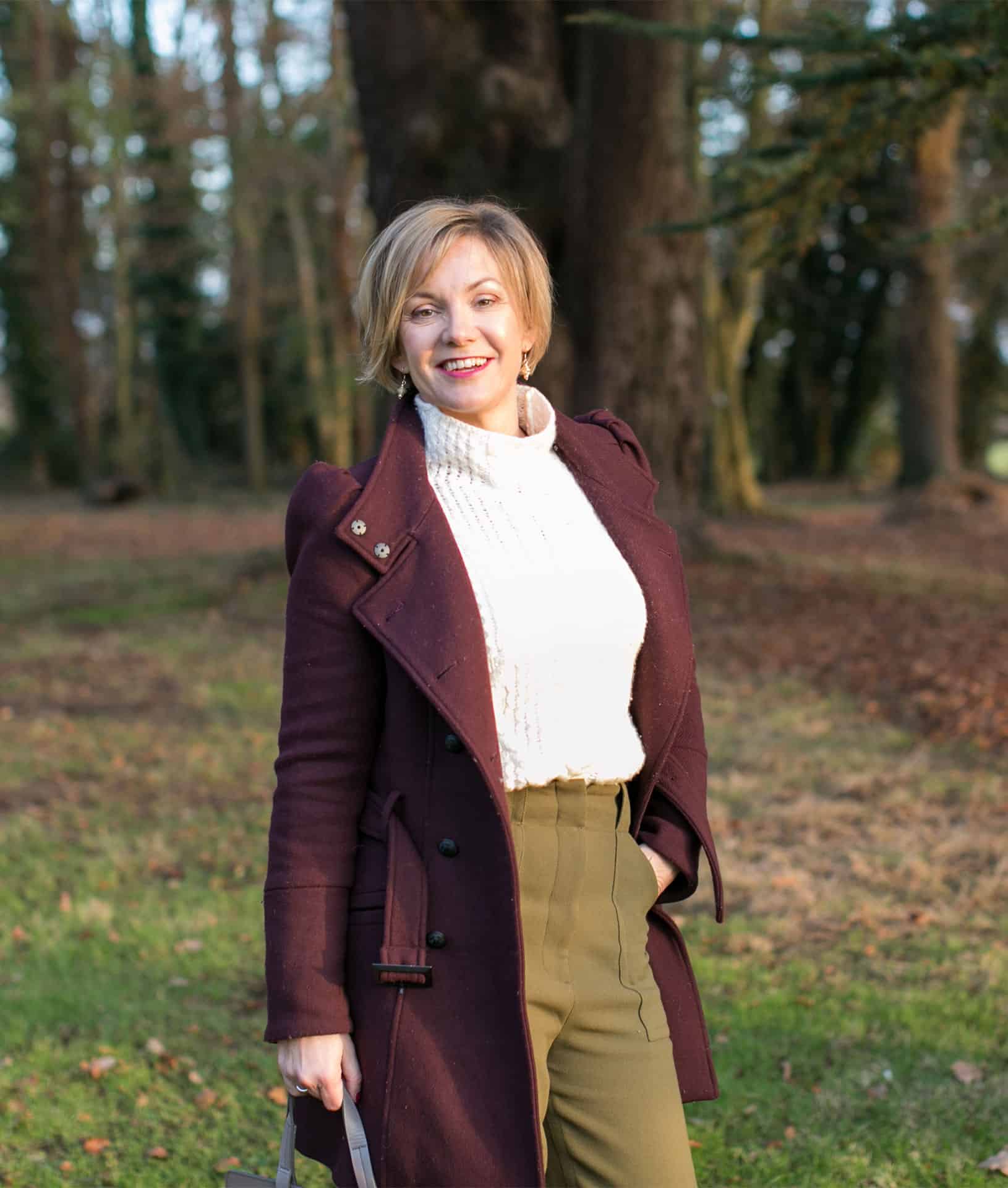 Kelly Chandler in a purple coat at conference for wedding venue owners