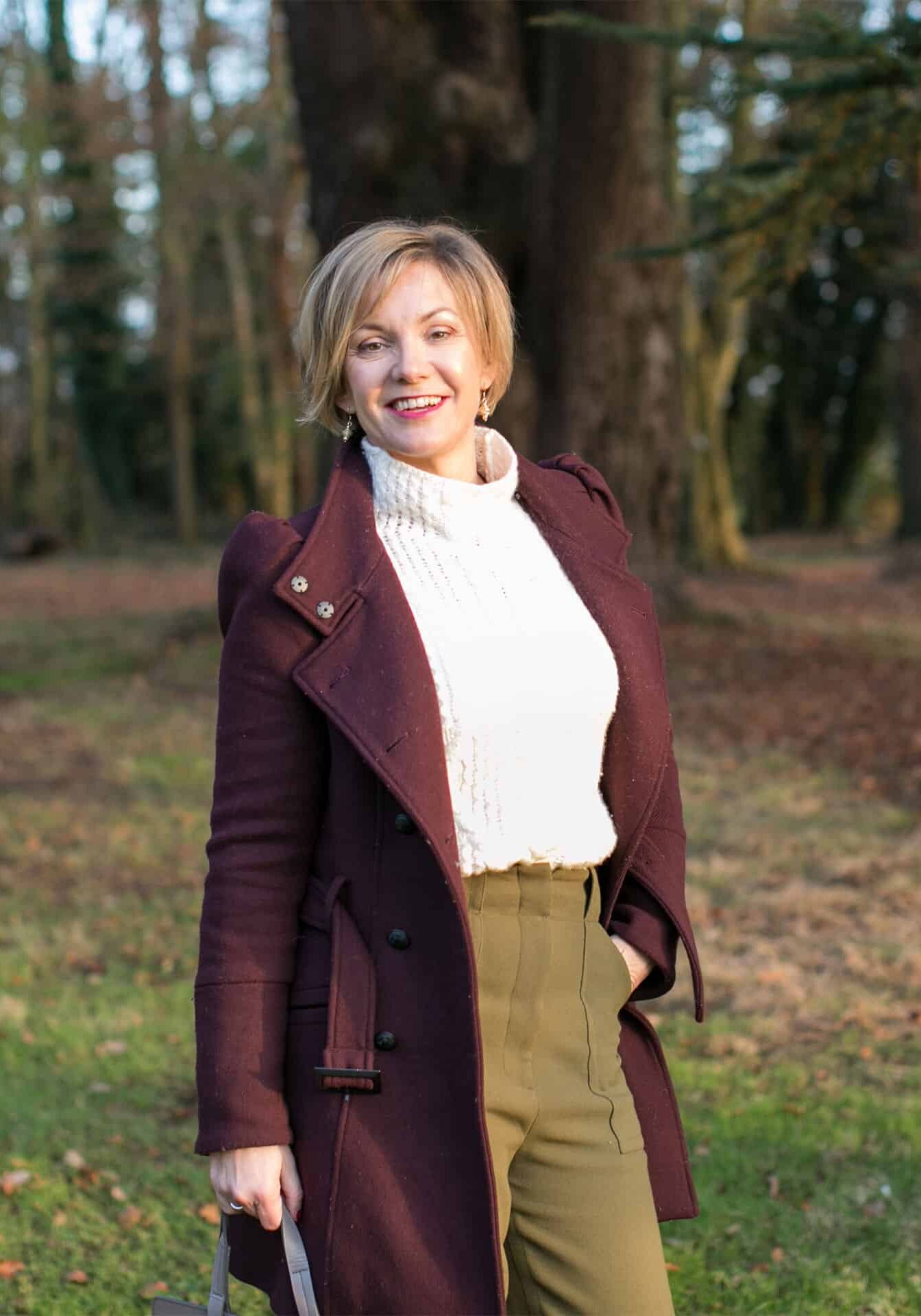 Kelly Chandler in a purple coat at conference for wedding venue owners